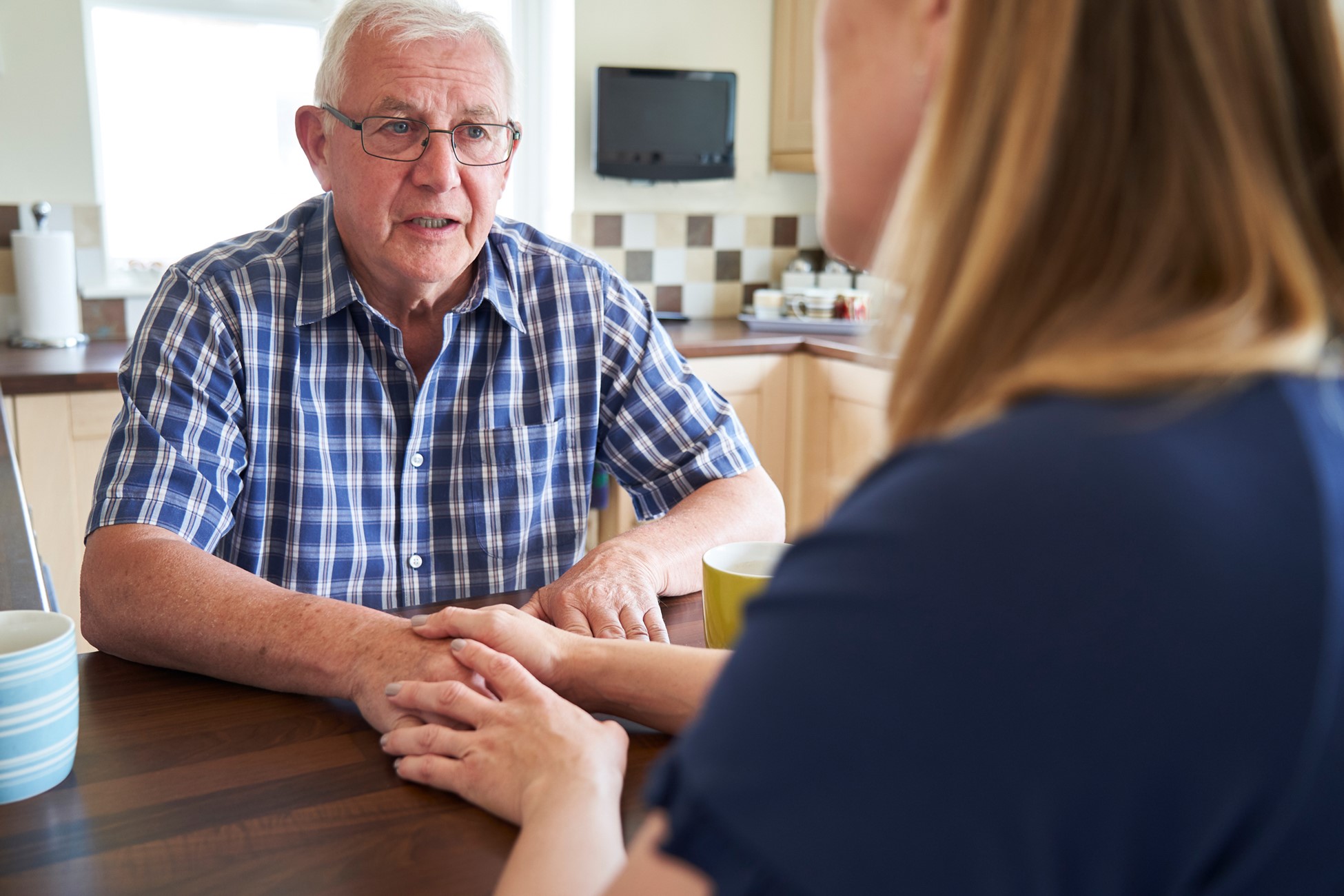 discussing senior care with elderly parent