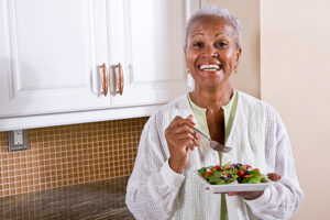 senior-woman-eating-salad