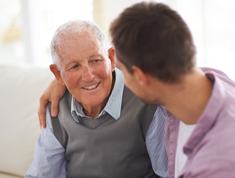 caregiver-with-arm-around-senior-man