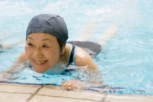 happy senior lady in swimming pool