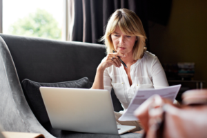 family caregiver reviewing finances online