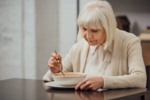 uninterested senior lady with lack of appetite