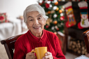 A senior woman enjoys her independence with support from a home care professional thanks to her family’s efforts in monitoring older loved ones for safety during their holiday visits.